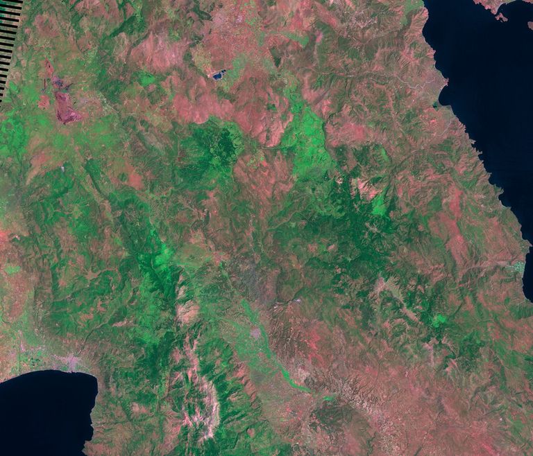 On August 24, 2007, the first of more than 170 fires broke out on the Greek Peloponnesus. The fires, of undetermined origin, cut a swath of destruction across the peninsula. They razed hundreds of villages, threatened the ancient historic site of Olympia and endangered the city of Sparta. These images show the area before and after the fires. Images taken by the Enhanced Thematic Mapper Plus sensor onboard Landsat 7. Source: U.S. Geological Survey (USGS) Landsat Missions Gallery, "Greece Fires," U.S. Department of the Interior / USGS.