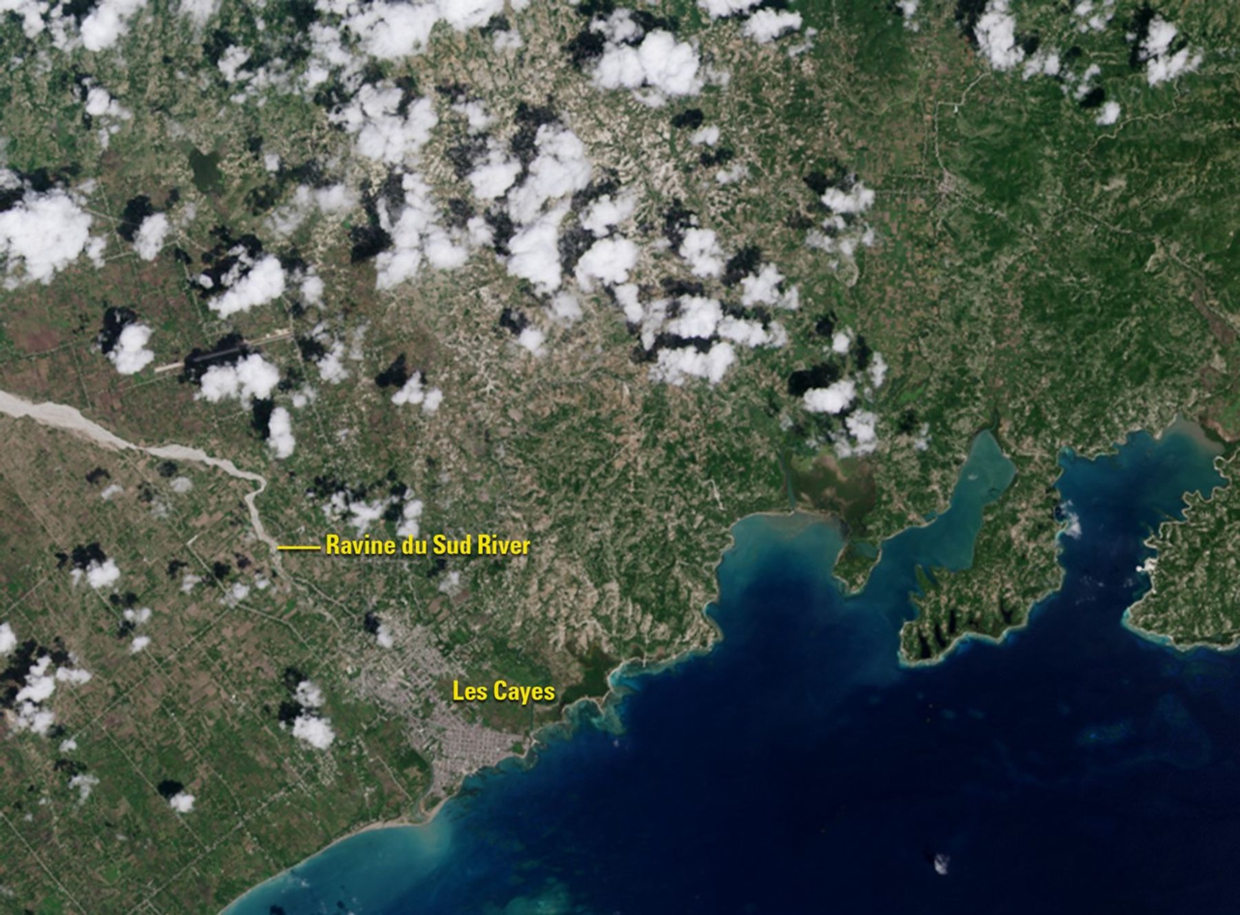 Hurricane Matthew pounded southwestern Haiti on October 4, 2016, washing away crops and other vegetation (green areas in the September image), which were often on steep slopes. Some of the eroded soil is visible as sediment at the mouth of the Ravine du Sud River. The storm dropped some 30 inches of rain on parts of the country and damaged or destroyed hundreds of thousands of homes. Images taken by the Operational Land Imager onboard Landsat 8. Source: U.S. Geological Survey (USGS) Landsat Missions Gallery; U.S. Department of the Interior / USGS and NASA.