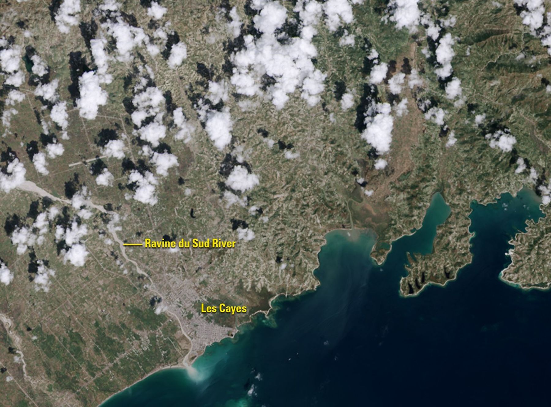 Hurricane Matthew pounded southwestern Haiti on October 4, 2016, washing away crops and other vegetation (green areas in the September image), which were often on steep slopes. Some of the eroded soil is visible as sediment at the mouth of the Ravine du Sud River. The storm dropped some 30 inches of rain on parts of the country and damaged or destroyed hundreds of thousands of homes. Images taken by the Operational Land Imager onboard Landsat 8. Source: U.S. Geological Survey (USGS) Landsat Missions Gallery; U.S. Department of the Interior / USGS and NASA.
