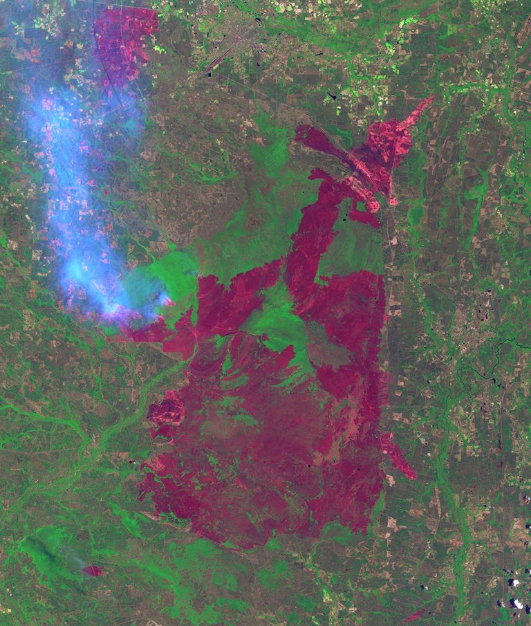 Lightning sparked wildfires near the Okefenokee National Wildlife refuge in the Honey Prairie region of Georgia, US, on April 30, 2011, after the left-hand image was taken. Dry conditions helped fuel the fires and continued lightning strikes started new ones. By July 7, over 290,000 acres had burned.
