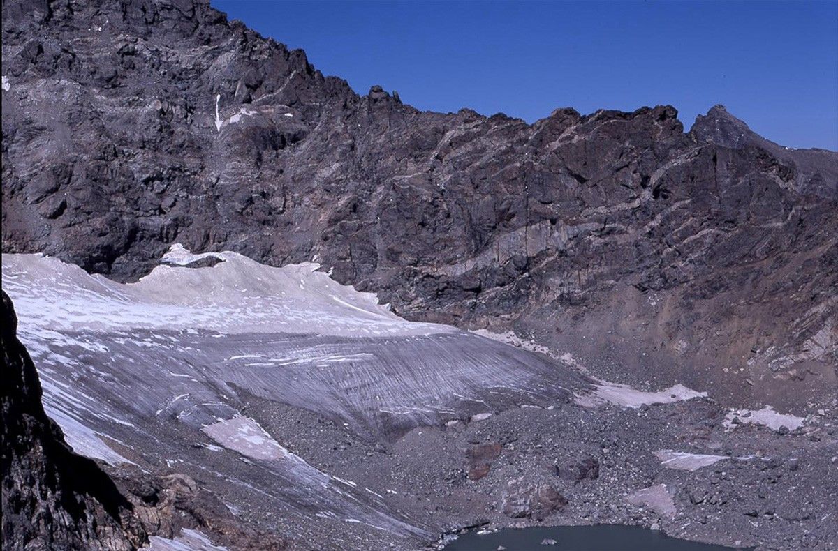 Arapaho Glacier has shrunk dramatically since it was photographed in 1898. Measurements collected since 1960 suggest the glacier has thinned by at least 40 meters since then; thinning between 1898 and 1960 is unknown but is probably considerably greater than 40 meters. 1898 photo taken by R. S. Brackett, published in "Arapaho Glacier: A Sixty Year Record," University of Colorado Studies, Series in Geology, No. 3, R. S. Waldrop (1964). 2003 photo taken by Tad Pfeffer. Images courtesy of Tad Pfeffer, Institute of Arctic and Alpine Research, University of Colorado.