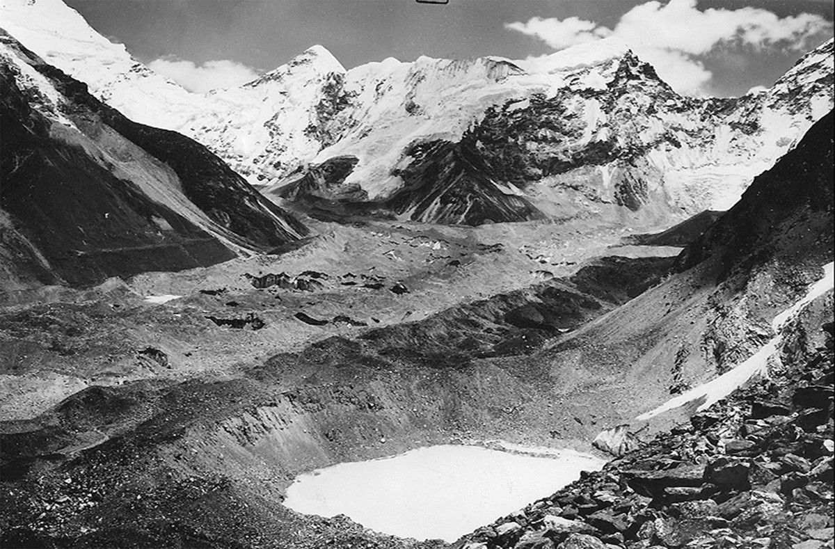 Imja Lake, the grayish glacial lake seen above Amphu Lake in the 2007 image, threatens to flood downstream communities if its unstable natural dam—consisting of dirt and rocks cemented by ice—gives way. It survived the Nepal earthquake of 2015 but remains hazardous. Imja Lake coalesced from a series of melt ponds that began forming on Imja Glacier, near Mt. Everest in the Himalayas, around 1960. By the mid-1970s, the ponds had merged into a single body of water, which has grown as the glaciers feeding it have retreated and thinned. The United Nations Development Programme has embarked on a project to lower the lake level and reduce the flood potential.   Images: 1956 picture courtesy of the Association for Comparative Alpine Research, Munich; photo taken by Erwin Schneider. 2007 picture courtesy of the Archives of Alton Byers and the Mountain Institute; photo taken by Alton Byers. Sources for text: “Nepal's Imja Lake, Khumbu Region, Appears Resilient Against Gorkha Quake” and United Nations Development Programme.