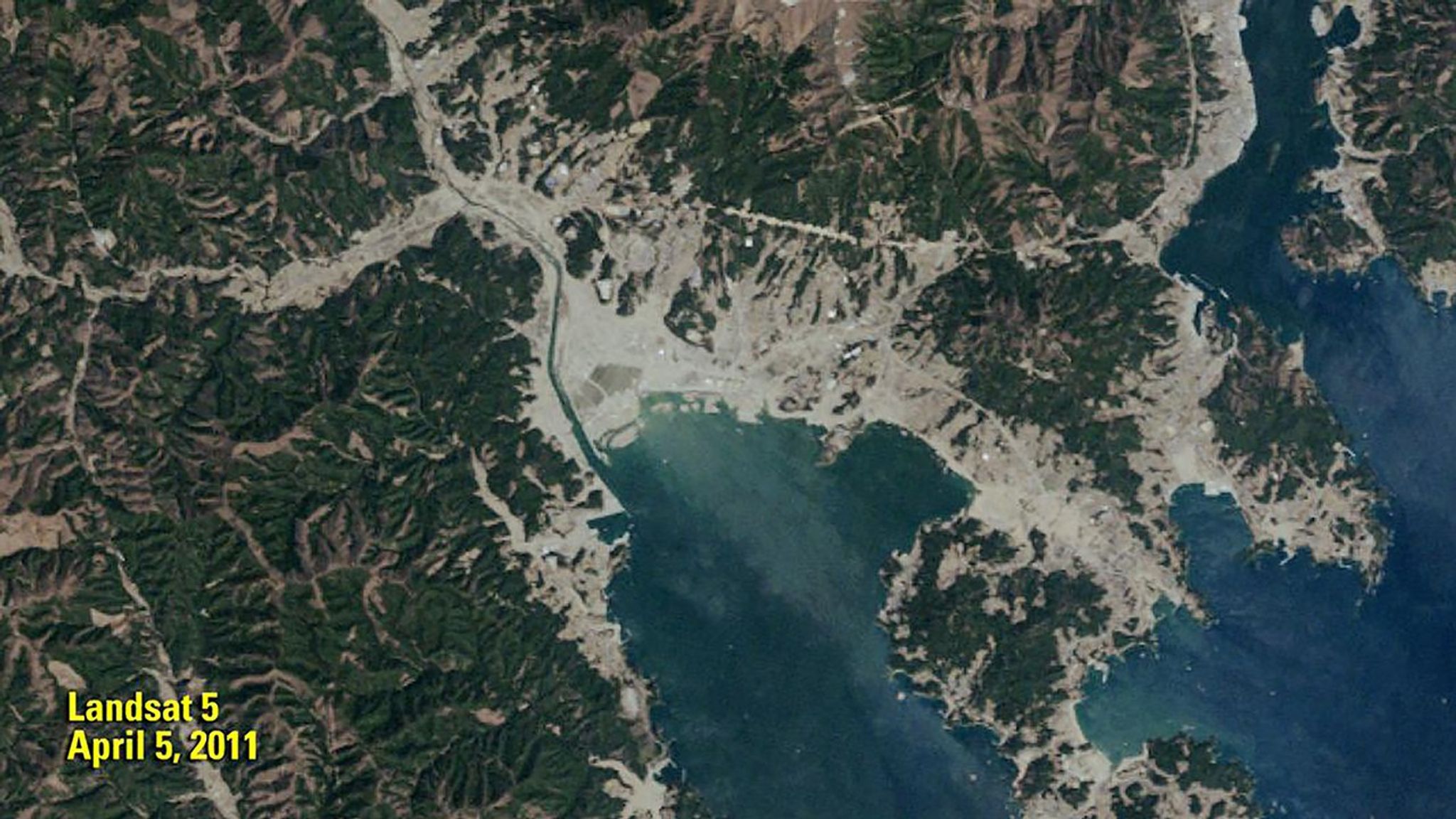 The 2011 image shows the remains of the Japanese town of Rikuzentakata (gray area in center) less than a month after a devastating tsunami. In the 2019 image, a sea wall, 41 feet (12.5 meters) high, stands between the town and Hirota Bay as a shield against future tsunamis. The 2011 image was taken by Landsat 5. The 2019 image was taken by ESA's Sentinel-2B satellite. Source: U.S. Geological Survey’s National Land Imaging Image Collections