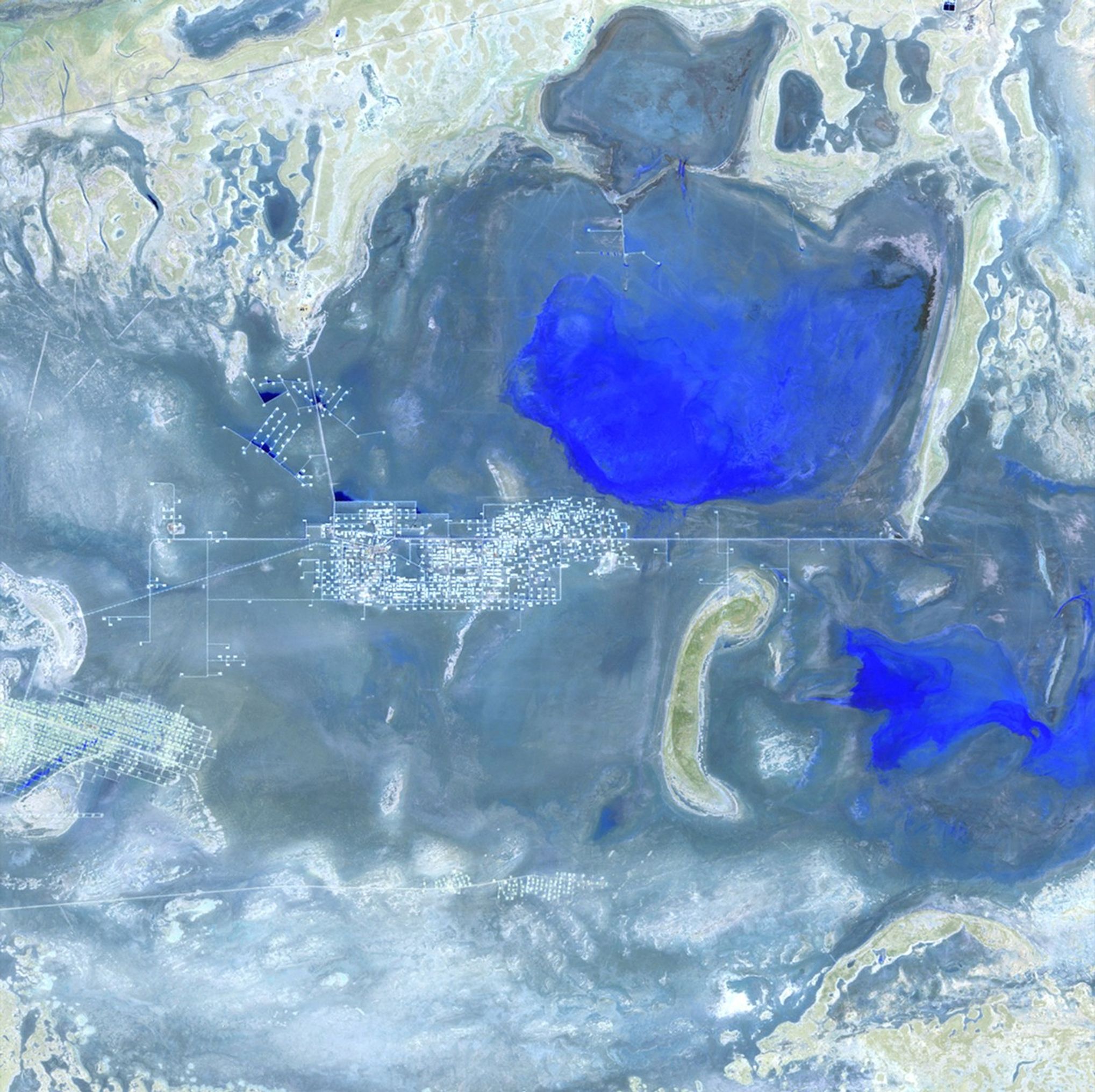 The landscape of Kazakhstan's Mangystau Province, near the Caspian Sea, has changed since oil and gas deposits in the region began to be exploited in the early 1990s. The 2011 image shows production facilities in the desert with settlements built around them. Increased fossil fuel production in this area has raised concerns about the quality and availability of freshwater needed for rural development and public health. Images taken by the Thematic Mapper sensor onboard Landsat 5. Source: USGS Landsat Missions Gallery, "Expanding Oil Production in Mangystau Province, Kazakhstan," U.S. Department of the Interior / U.S. Geological Survey.