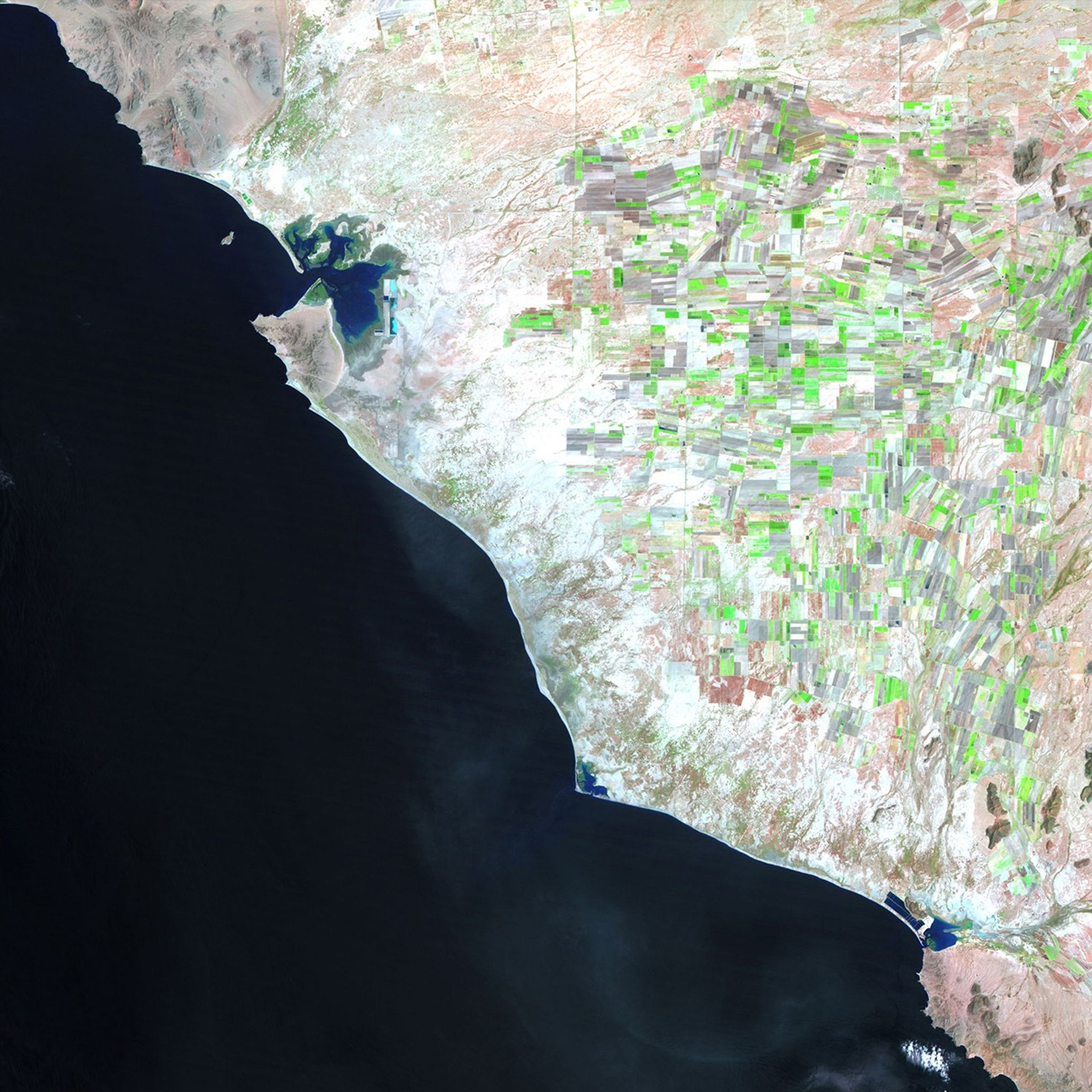 Left: August 7, 1993. Right: July 8, 2011. These images show changes to the western coastline of Sonora, Mexico due to the construction of shrimp farms over the past two decades. While the shrimp industry has generated profits and jobs, there have been concerns about its effect on the ecosystems of the region, and disputes have arisen about property rights to the communal coastal lands.