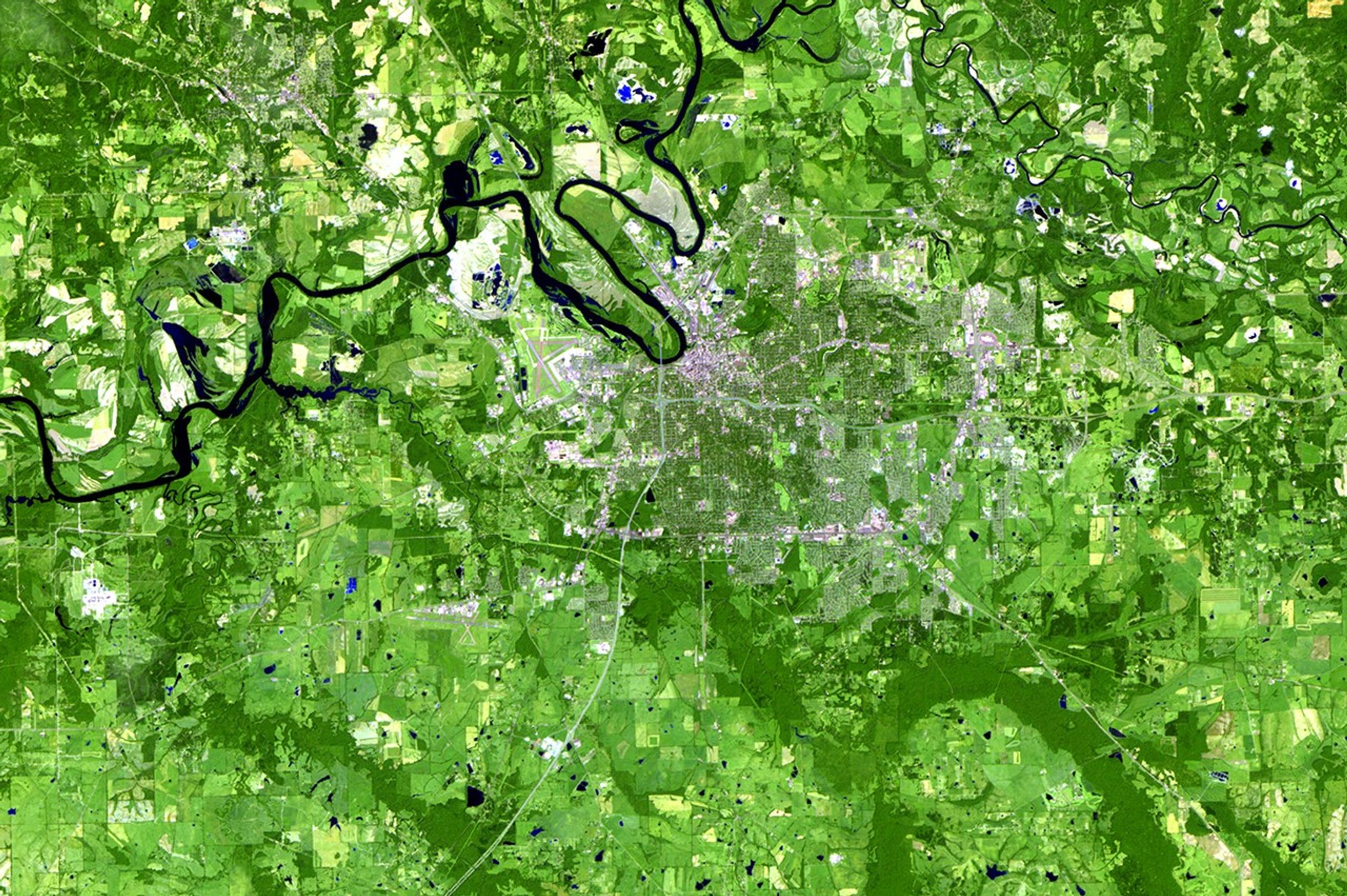 Montgomery, the capital of Alabama, sits by the Alabama River in the south central portion of the state. Its population has nearly doubled during the past 30 years, from just under 125,000 to more than 200,000, thanks to increased tourism and commercial and industrial development. These images show changes from forest and croplands to urban and industrial areas around Montgomery and Prattville, located across the river on the northern side. The changes have been a major factor in altering regional air quality and the production of crops and lumber. Images taken by the Thematic Mapper sensor onboard Landsat 5. Source: U.S. Geological Survey (USGS) Landsat Missions Gallery, "Urban Growth of the Montgomery, Alabama, area," U.S. Department of the Interior / USGS and NASA.