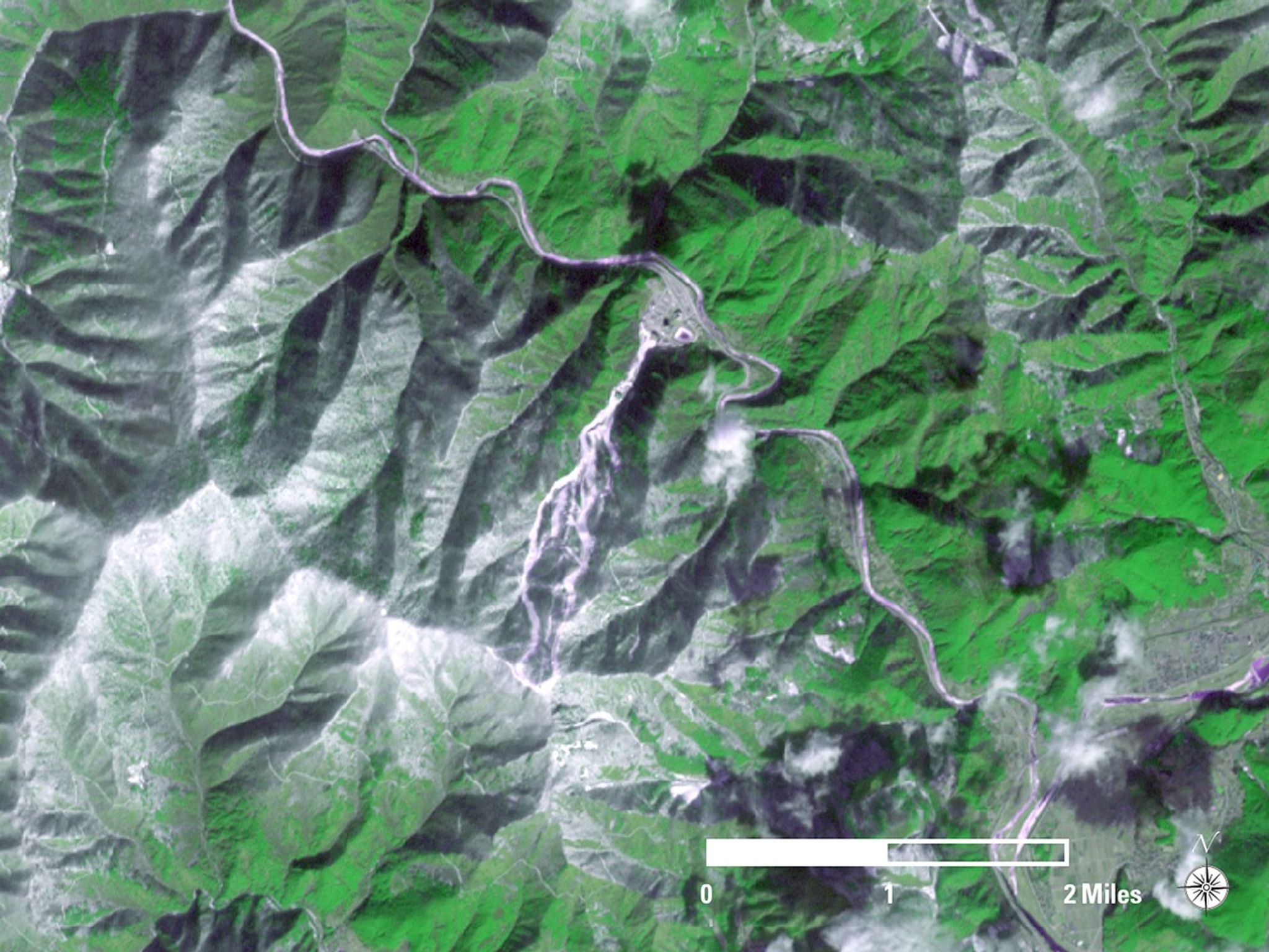 South Korea’s Jeongseon Alpine Centre was built on heavily forested Mount Gariwang for the 2018 Winter Olympics skiing events. The 2013 image shows the area before renovations, which included the removal of 58,000 trees. The 2018 image was taken during the games. In these pseudo-true-color images, snow is white and forest appears bright green.   Images taken by the Advanced Spaceborne Thermal Emission and Reflection Radiometer (ASTER) on NASA's Terra satellite. Source: U.S. Geological Survey’s Land Remote Sensing Image Collections.