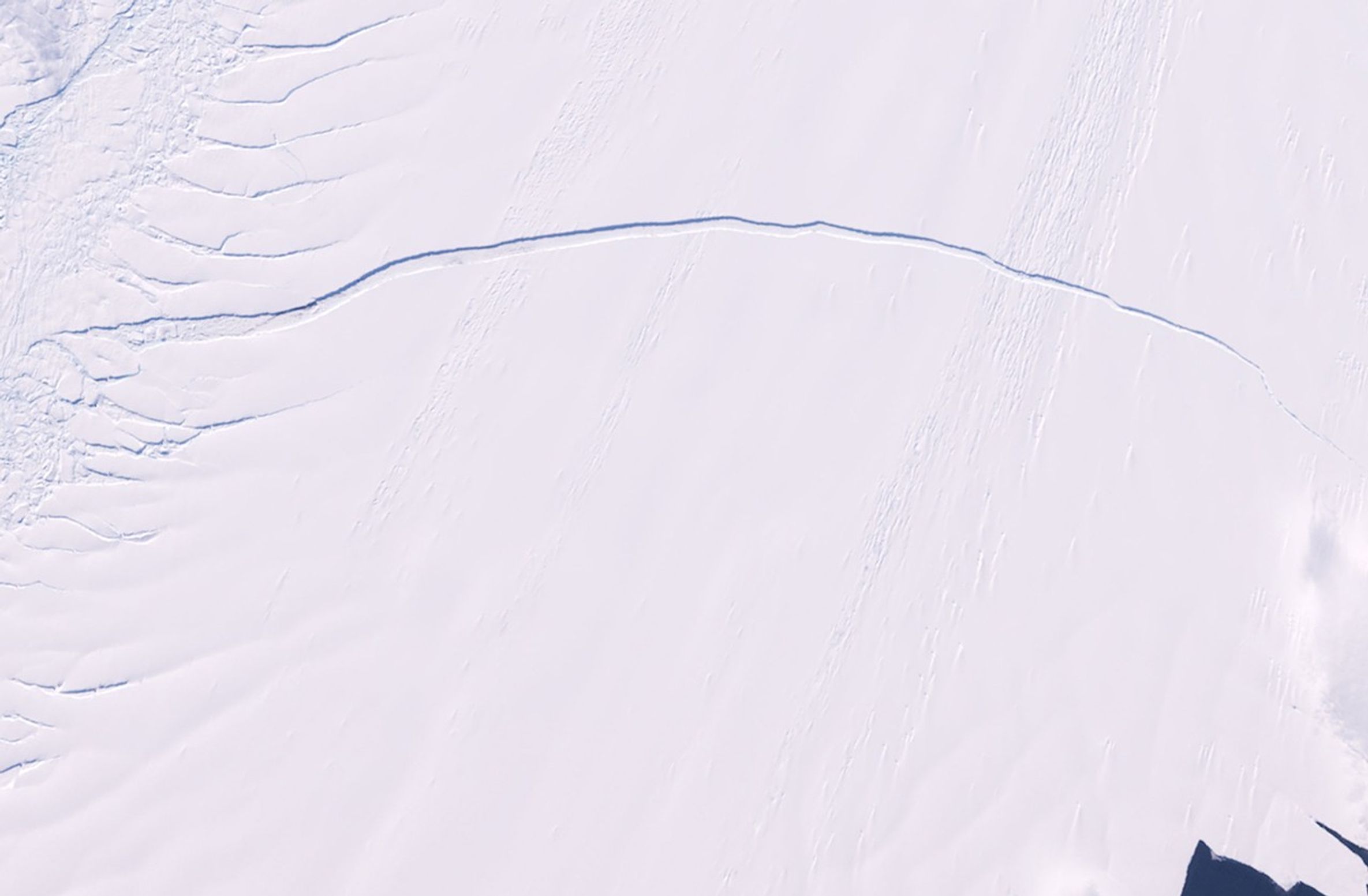 Pine Island is one of the largest and fastest-moving glaciers in Antarctica. The Pine Island Glacier Basin contributes more ice to the sea than any other ice-drainage basin in the world, and this has increased due to recent acceleration of the ice stream caused by thinning of the glacier. Scientists are concerned about the impact Pine Island's continued thinning will have on sea level. The 2011 image shows a series of splits along the western edge of the glacier. The same area in 2012 reveals a major break that will eventually extend all the way across the glacier and calve a giant iceberg expected to cover about 350 square miles (900 square kilometers). Images taken by the Enhanced Thematic Mapper Plus sensor onboard Landsat 7. Source: U.S. Geological Survey (USGS) Landsat Missions Gallery, "Pine Island Glacier," U.S. Department of the Interior / USGS.