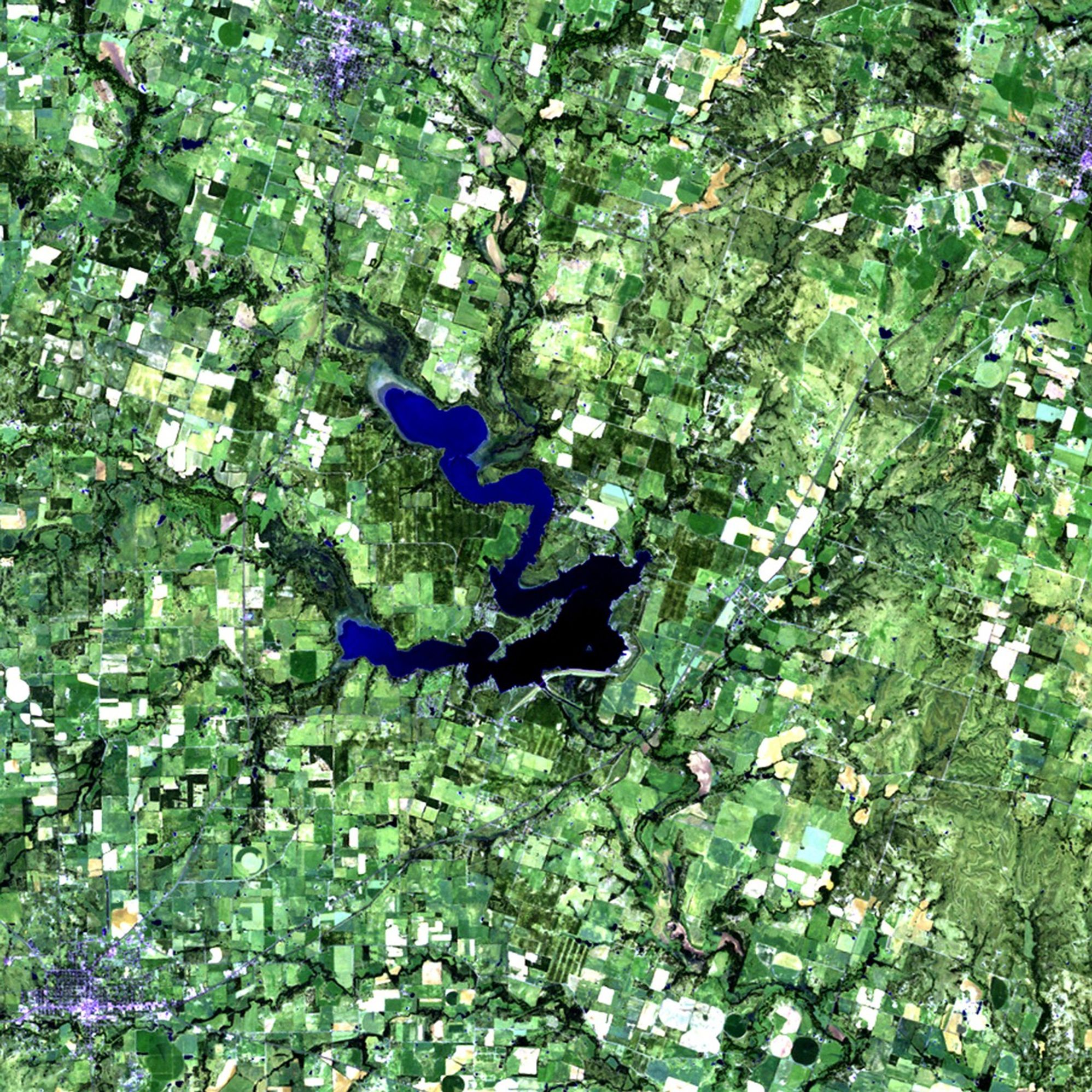 Dry conditions since mid-2010 have caused a large portion of Texas to be in an "exceptional" state of drought, the worst condition on the Federal government's drought monitor scale. The 12-month period between October 2010 and September 2011 was the driest in Texas since 1895, when the state began keeping rainfall records. Not only have crops and farmland been affected, but the levels of many lakes in the state have also fallen. Seen here is the area surrounding Proctor Lake, southwest of Dallas. Much of 2010's green vegetation has given way to barren ground (lighter shades) in 2011. Reduced water levels from the two major feeder rivers, the Sabanna and Leon Rivers, are responsible for the lake's receding shoreline. Proctor Lake reservoir was created by the U.S. Army Corps of Engineers in 1963 as a flood-control measure, and provides drinking water and recreation facilities to neighboring communities. Images taken by the Thematic Mapper sensor onboard Landsat 5. Source: USGS Landsat Missions Gallery, "Proctor Lake Affected by Texas Drought," U.S. Department of the Interior / U.S. Geological Survey.