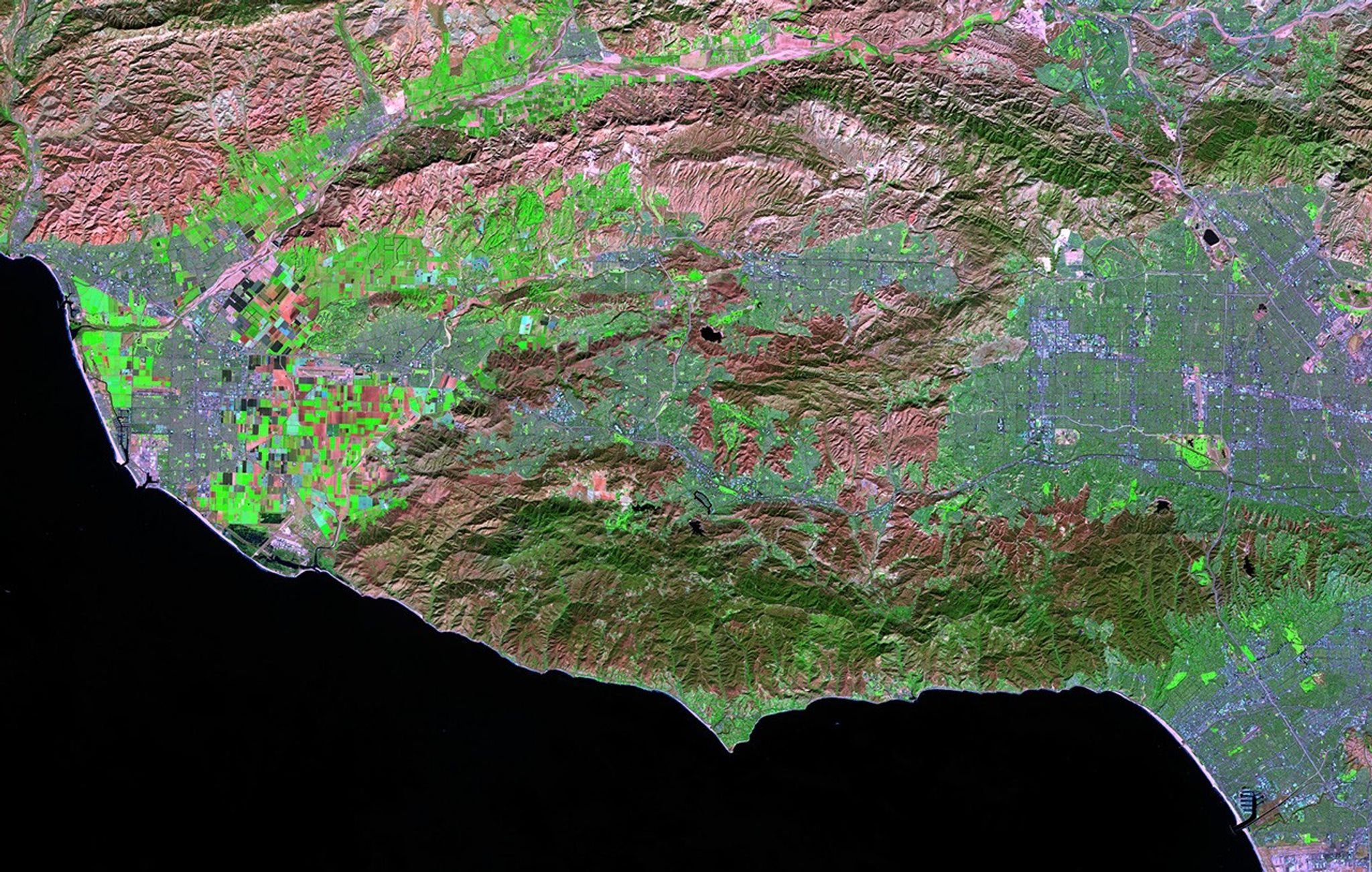 The Woolsey Fire burned some 97,000 acres of Southern California in November 2018. The large maroon patch at the bottom of the later image shows, in false color, the burn scar between Los Angeles, Thousand Oaks and Malibu. The earlier image shows the same region before the fire began. See also the Camp, Mendocino Complex, County, Thomas, and Wine Country fires.   Earlier image taken by Landsat 8, later image taken by Landsat 7. Source: U.S. Geological Survey’s Earth Resources and Science Center