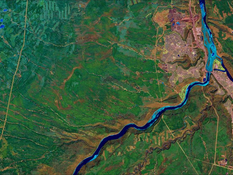 A massive wildfire near Fort McMurray in Alberta, Canada, destroyed at least 1,600 structures and forced the largest evacuation on record in Canada, involving more than 88,000 people. By May 5, fire had consumed almost 210,000 acres. The false-color images in the May picture depict active hot spots as bright orange, the burned area as dark red and smoke as hazy blue. This location is home to the Athabasca oil sands, the largest known reservoir of crude bitumen in the world. Images taken by the Operational Land Imager onboard Landsat 8. Source: U.S. Geological Survey (USGS) Landsat Missions Gallery; Wildfire Forces Evacuations in Fort McMurray, Alberta; U.S. Department of the Interior / USGS and NASA.