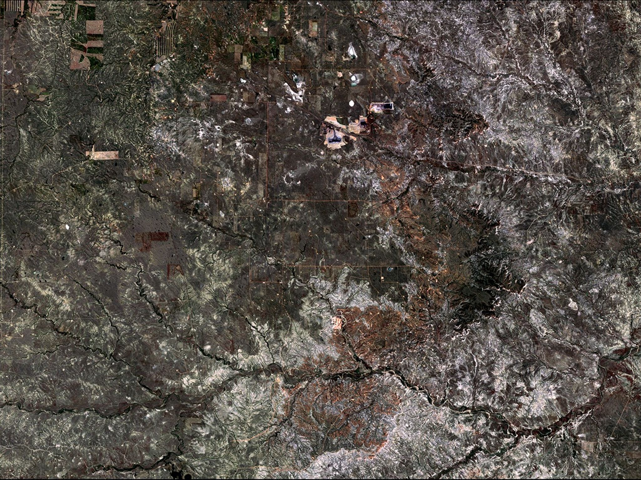 Wyoming’s Powder River Basin hosts the North Antelope Rochelle Complex—largest coal mine in the U.S.—and the Black Thunder Mine. Together, they produced 22 percent of the U.S. coal supply in 2014. These images show the landscape’s change from predominantly agricultural use to open-pit mining. USGS officials estimate that these mines have less than 20 years of economically recoverable coal remaining, after which the companies will be required to reclaim the land.   Images taken by the Thematic Mapper onboard Landsat 5 and the Operational Land Imager onboard Landsat 8. Source: U.S. Geological Survey (USGS) Landsat Missions Gallery; “Landsat Reveals Industrial Growth in Powder River Basin”; U.S. Department of the Interior / USGS and NASA.