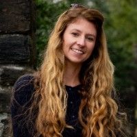 The headshot image of Emily DeMarco