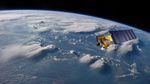 An illustration of the Aqua satellite is shown over an image of thunderstorms over Borneo.