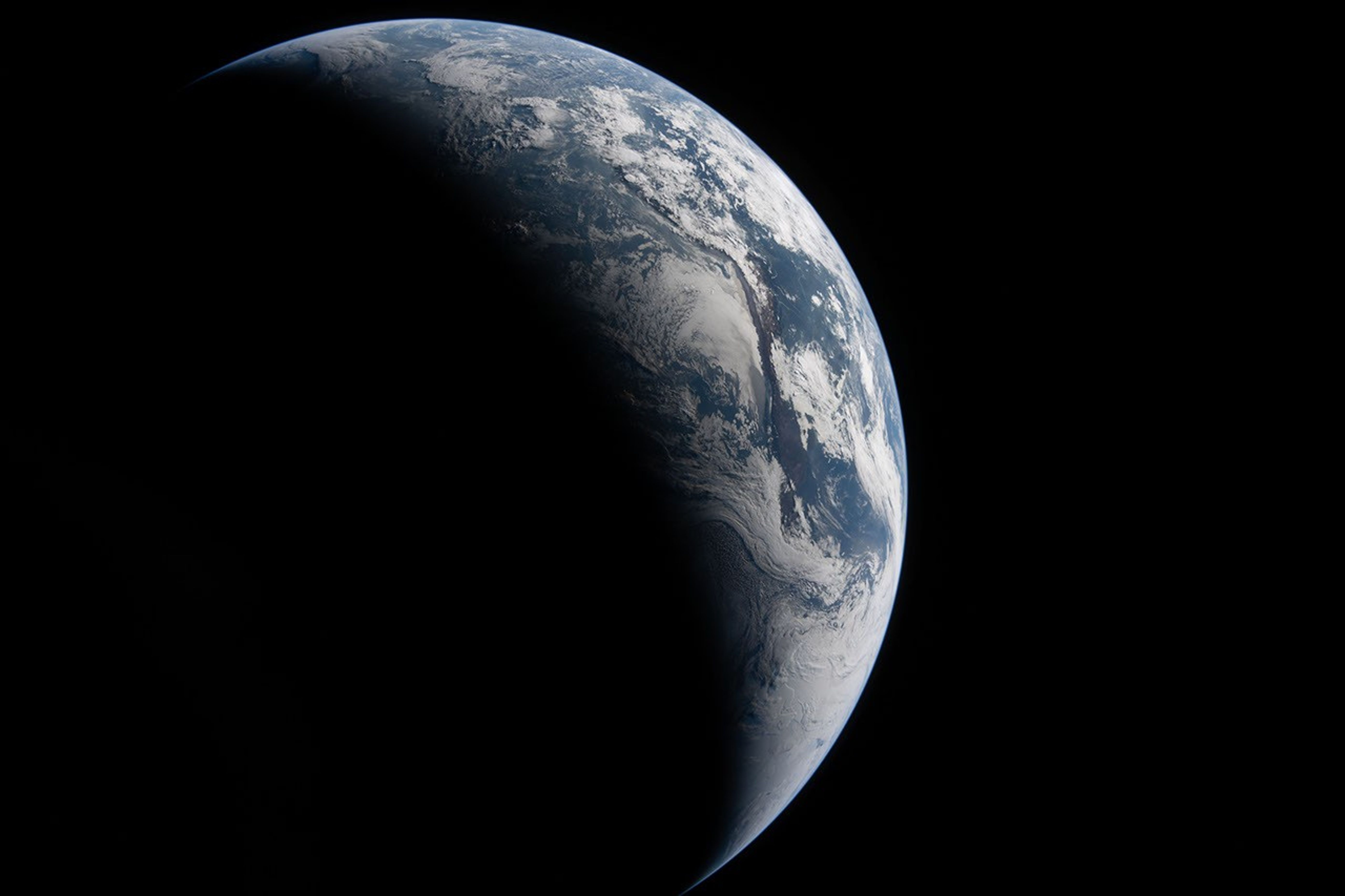 La Tierra sobre el fondo negro del espacio, con su lado izquierdo en la oscuridad y su lado derecho iluminado, revelando océanos azules y nubes blancas arremolinadas. Una suave frontera entre el día y la noche se curva a lo largo del globo.