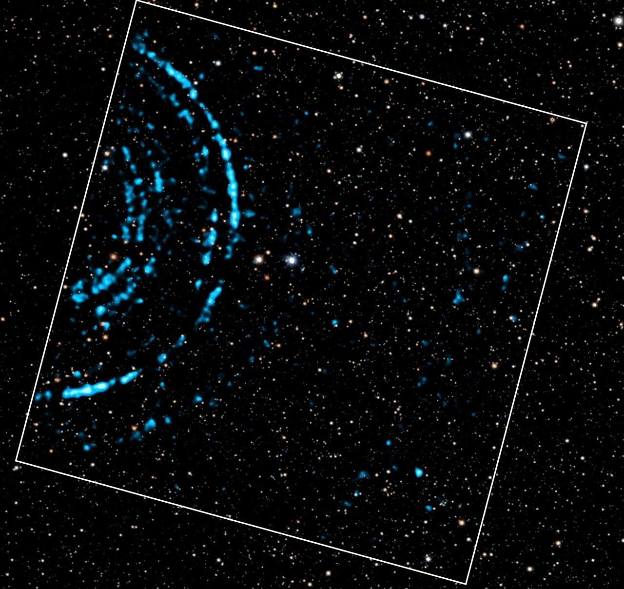 The images include X-ray data from Chandra and optical data from Pan-STARRS. The composite image shows X-ray rings generated by a gamma-ray burst (GRB), a bright X-ray source located outside our galaxy. In a phenomenon called light echoes, the X-rays from the GRB bounced off dust clouds in the spiral arms of our galaxy. The diameters of the rings in the Chandra data give the distances of the dust clouds to Earth, with larger rings being generated by dust clouds closer to us. The GRB is located at the center of the circles defining the rings, to the left of the X-ray data outlined by the white square.