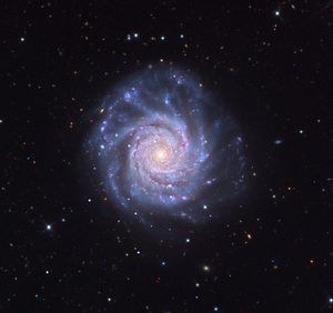 A face-on spiral galaxy whose orientation gives us an unobstructed view of its disk. X-ray emissions from Chandra (magenta) detail energetic X-ray binaries and supernova remnants scattered across dust lanes in an optical image (white, blue and gold) from Adam Block with Mt. Lemmon Observatory. Face-on orientations are important for galactic studies because they provide the most unobstructed views of a galaxy’s stars and gas.
