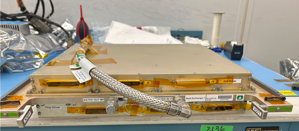 Science Module 3X before its delivery to ISS with its magnetic shield (silver) and a panel (gold) for electrical, optical and fluid connections.