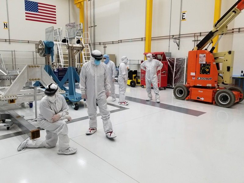 Europa Clipper engineers use mixed reality (also known as augmented reality, or AR) headsets to examine Europa Clipper’s avionics module assembly in a clean room at NASA's Jet Propulsion Laboratory.