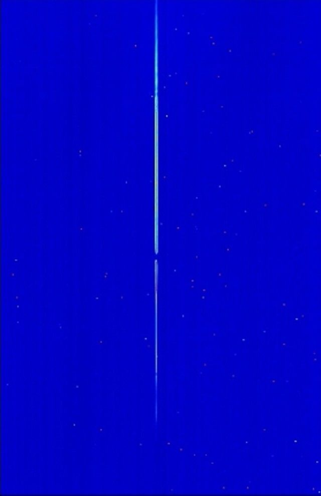 A blue image with a thin vertical white line in the center.