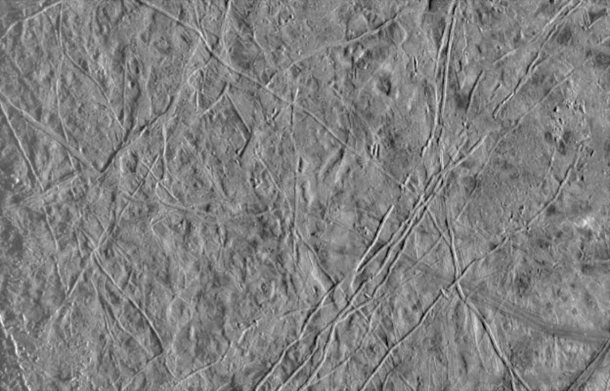 black and white view of ridges and other landforms on the icy surface