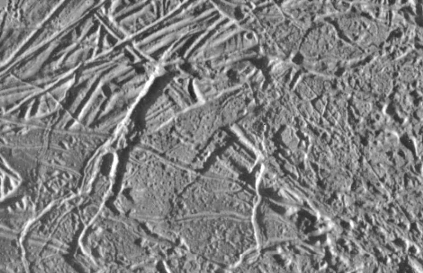 black and white view of rough terrain on an icy surface