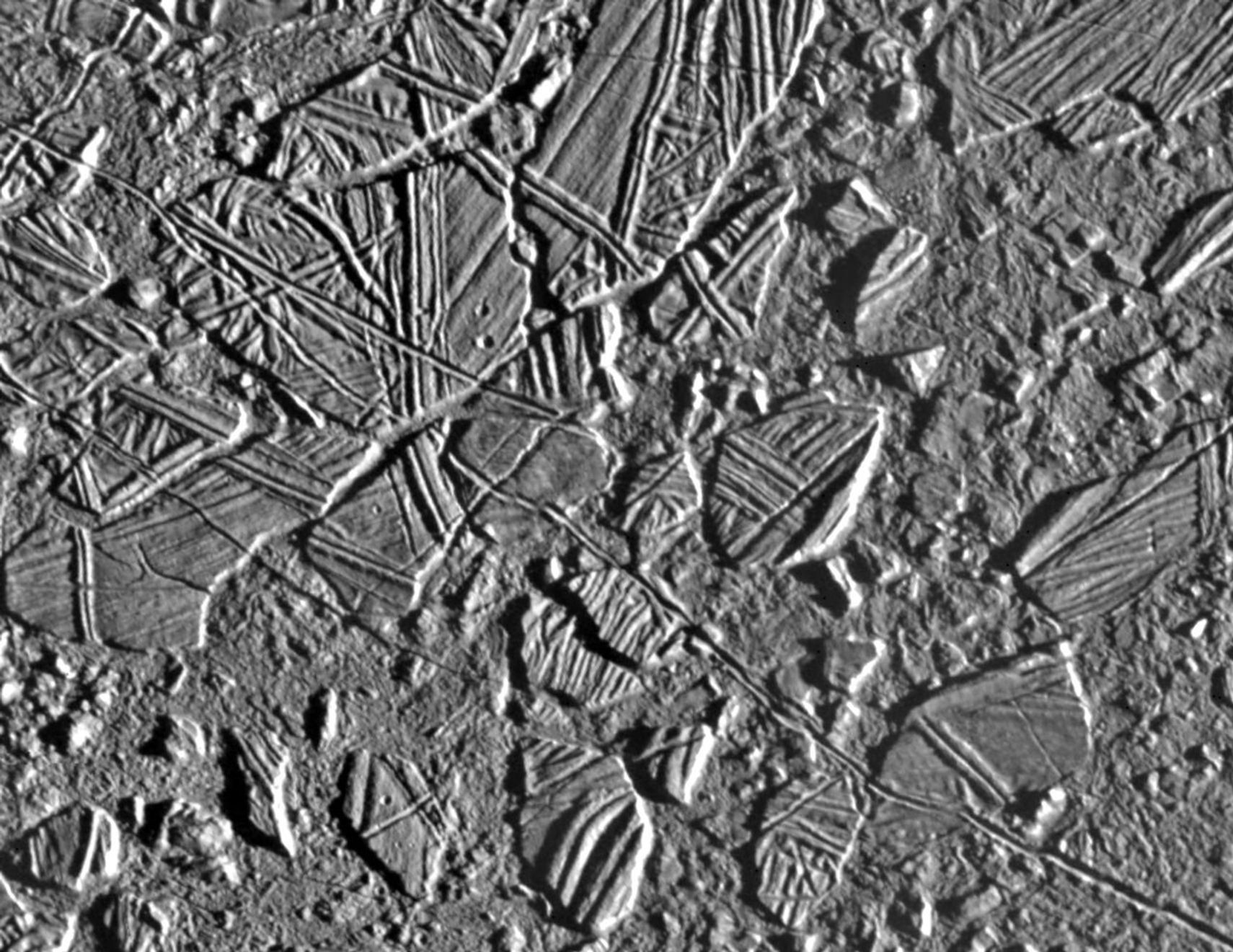 black and white view of rough terrain on an icy surface