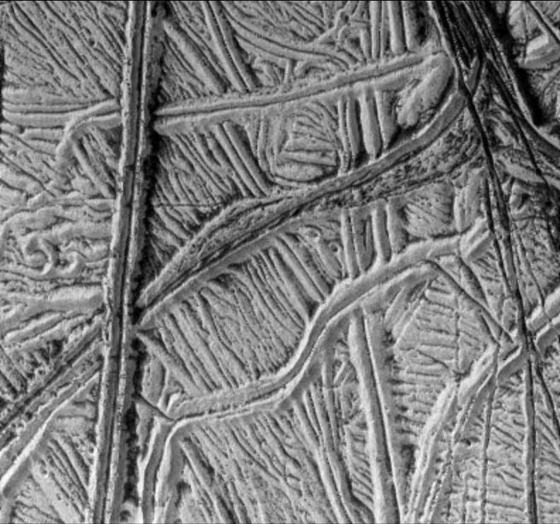 black and white view of ridges and rough terrain on an icy surface