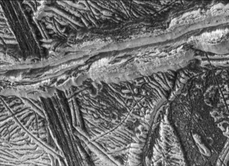 black and white view of ridges and rough terrain on an icy surface
