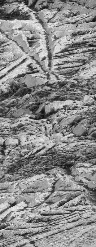 black and white view of ridges and rough terrain on an icy surface