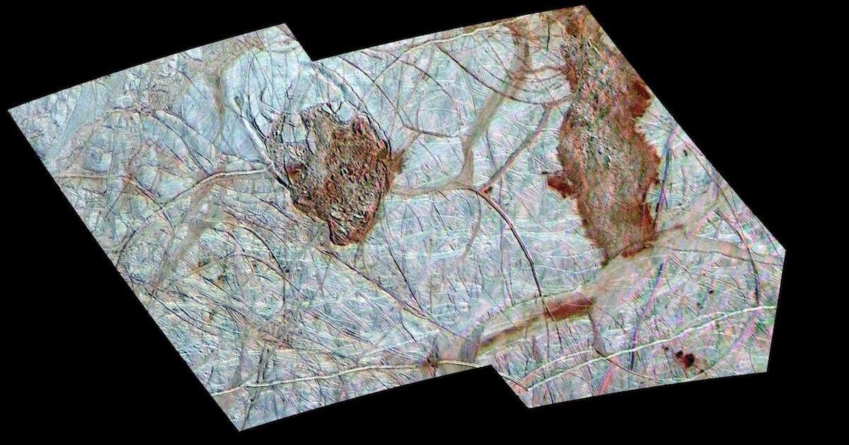 color view of two darker regions on an icy terrain