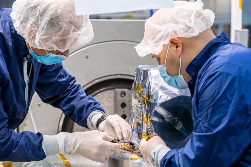An accelerometer is attached to a plasma instrument sensor assembly during a vibration test.