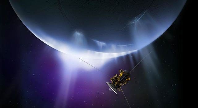NASA's Cassini spacecraft is visible in front of Saturn's moon Enceladus, which is seen as a white, frosty glove with plumes in the lower left of the moon. The space around it has a purple color.