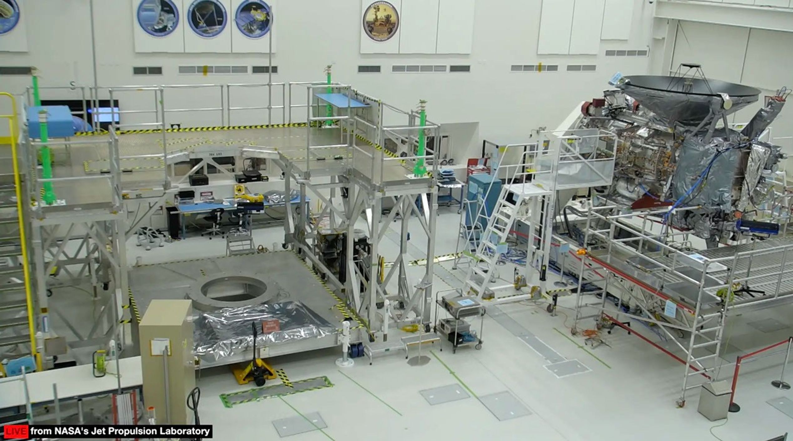 A large room with lots of equipment for building a spacecraft.