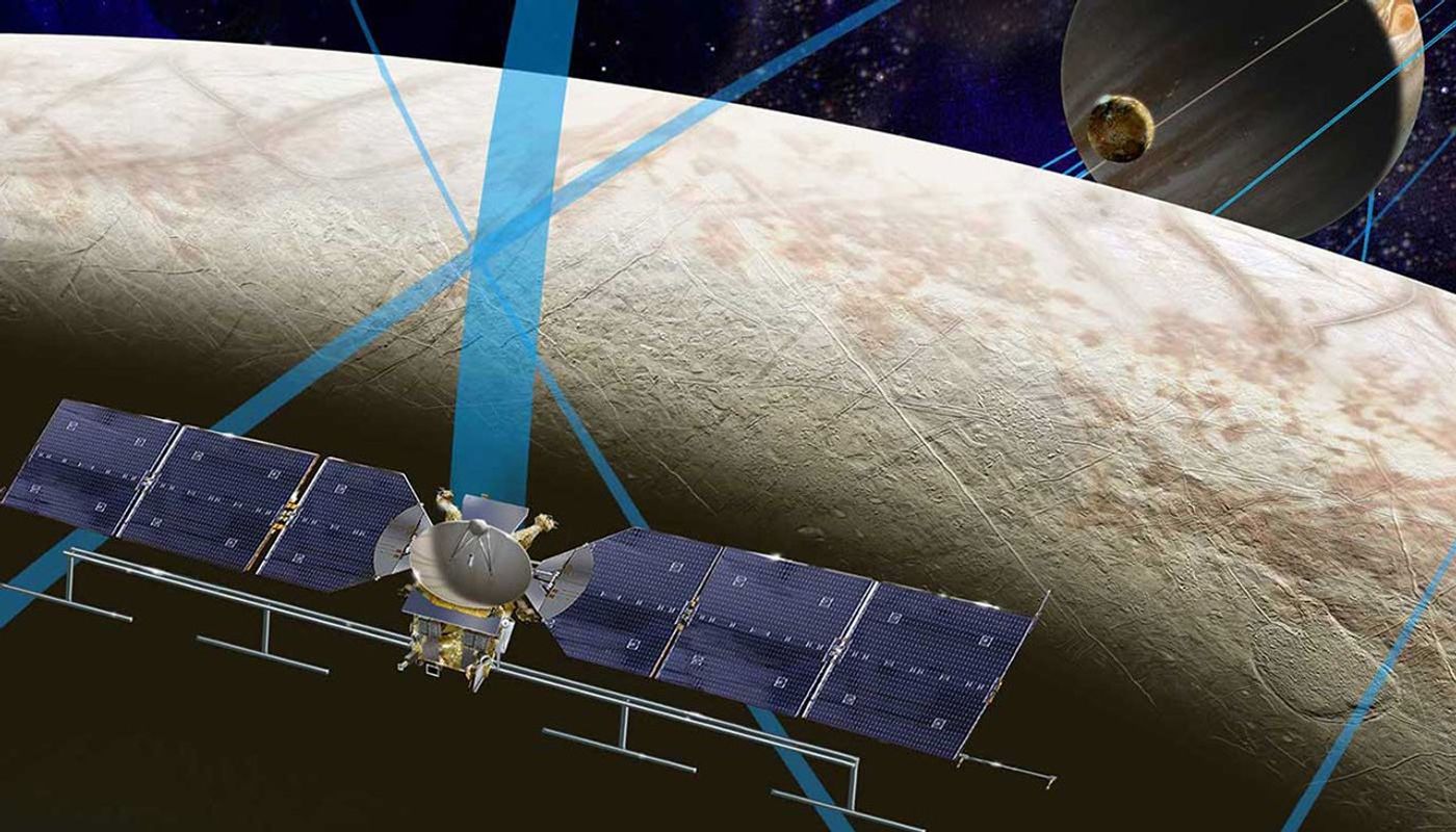 An artist's concept of a blue spacecraft hovers above Europa.