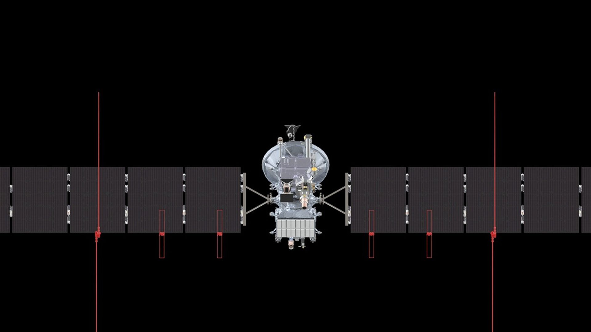 A silver spacecraft against the blackness of space with one instrument highlighted in red.
