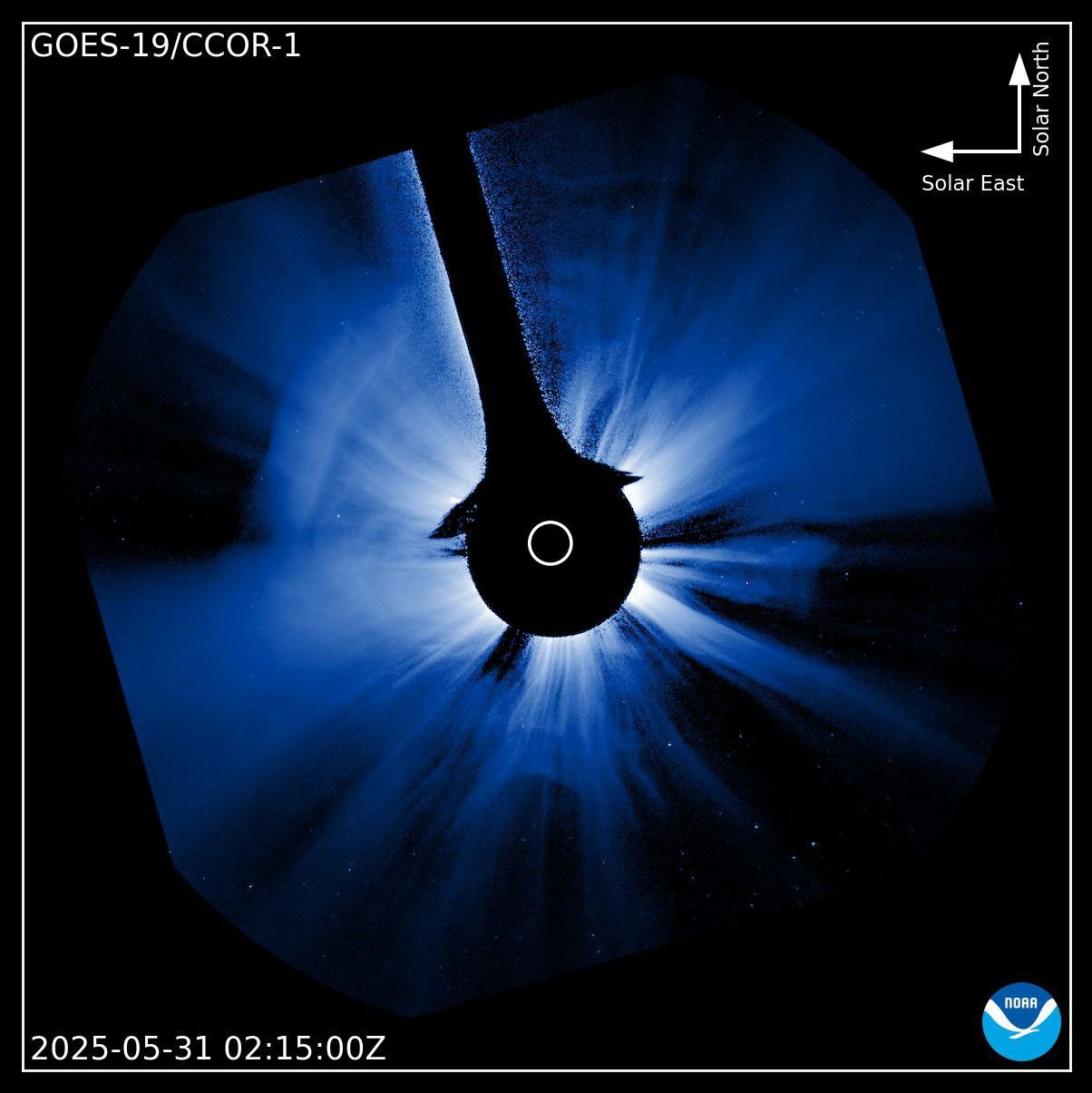 An image from the GOES CCOR INstrument that is a blueish flare on a black background.  The flare is unevenly radiating out from the center in all directions with striations of varying shades of blue.