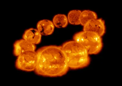 A series of bright, fiery images of the Sun are arranged in a circular formation against a black background. Variations in solar activity are visible on the Sun's surface, creating a glowing, dynamic pattern.