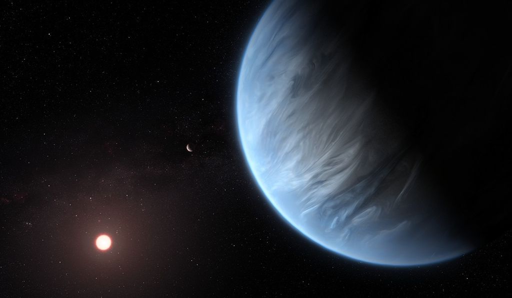 An exoplanet takes up the whole right-side of the image in the foreground. The planet's night side appears black, taking up the upper-right corner, and its day side on the left (near the center of the image) is light blue with gray clouds. Another planet appears as a small sphere in the background near the center, and the red-orange host star shines in the lower-left, all with a black background with white stars.