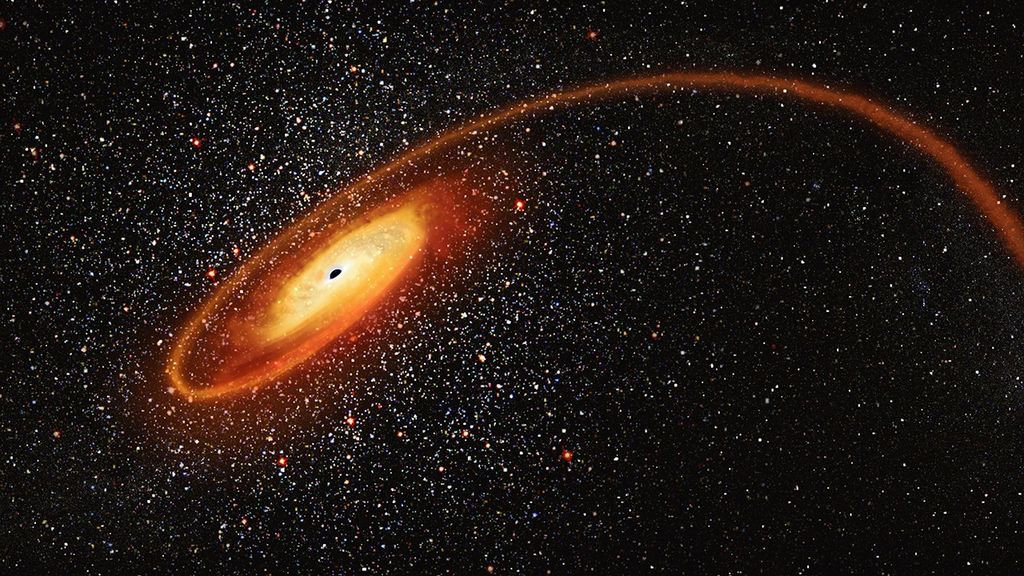 In the center-left of the image, a small black sphere of a black hole is surrounded by a yellow disk of gas, which blends to orange out near the edges. One orange trail of gas first spirals away from the disk to the left before wrapping around to the right, stretching all the way across the image to the right edge. White stars dot the image throughout, in thicker concentration around the black hole before thinning out farther away from it.