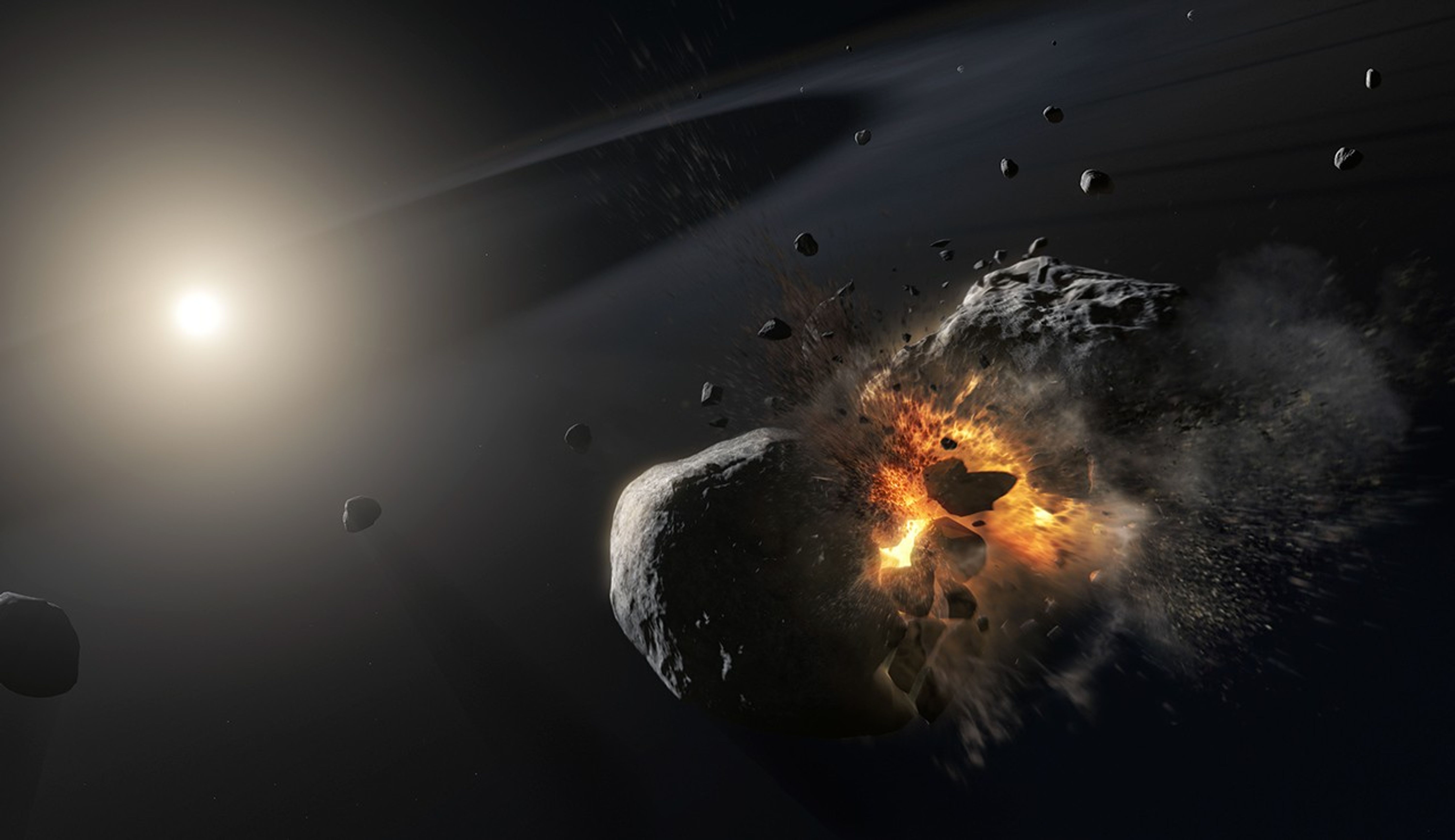 In the foreground in the lower right, two gray rocks slam into each other, with the center of their collision glowing bright yellow-orange and small pieces of rock flying off in all directions. Scattered in the background are several more small gray rocks like asteroids floating in a thin, wispy gray disk. On the left side of the image is a brightly-glowing white star with a slight yellow tint.