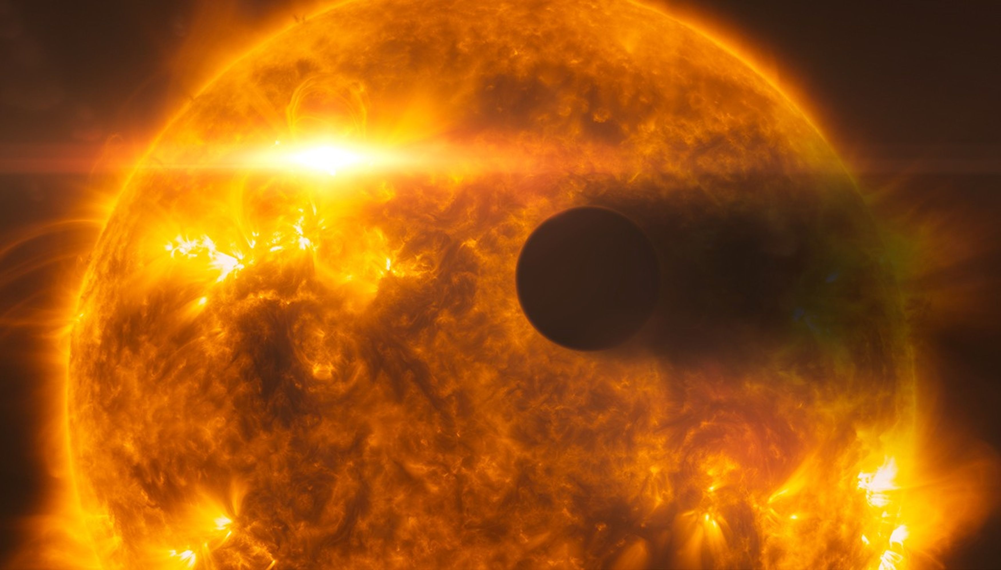 The parent star takes up most of the image as a deep orange ball of flame, with "hot spots" of yellow patches scattered in a few places. In the foreground, the planet appears as a dark sphere, with its evaporating atmosphere appearing as a black cloud to the right of the planet.