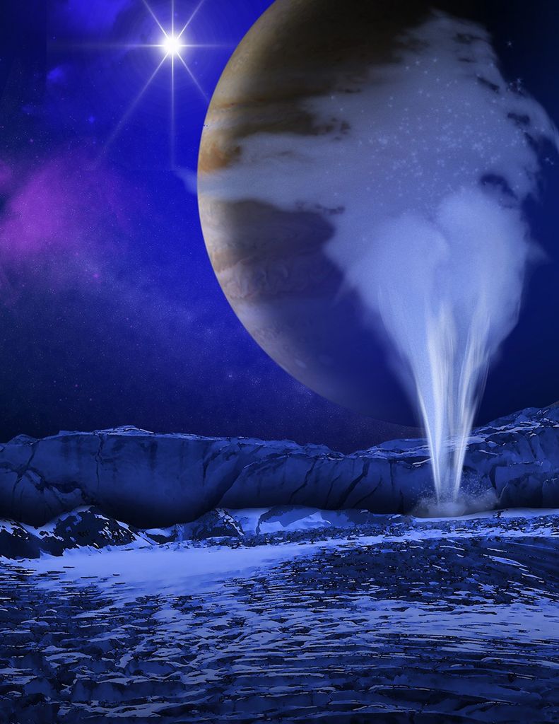 The lower half of the image is a jagged icy surface, with a plume of water shooting up on the right to near the top of the image. This plume partially obscures the view of Jupiter, with its orange, brown, and white clouds, which fills the entire top-right quadrant. The Sun appears as a shining white glow at the very top of the image, slightly to the left.