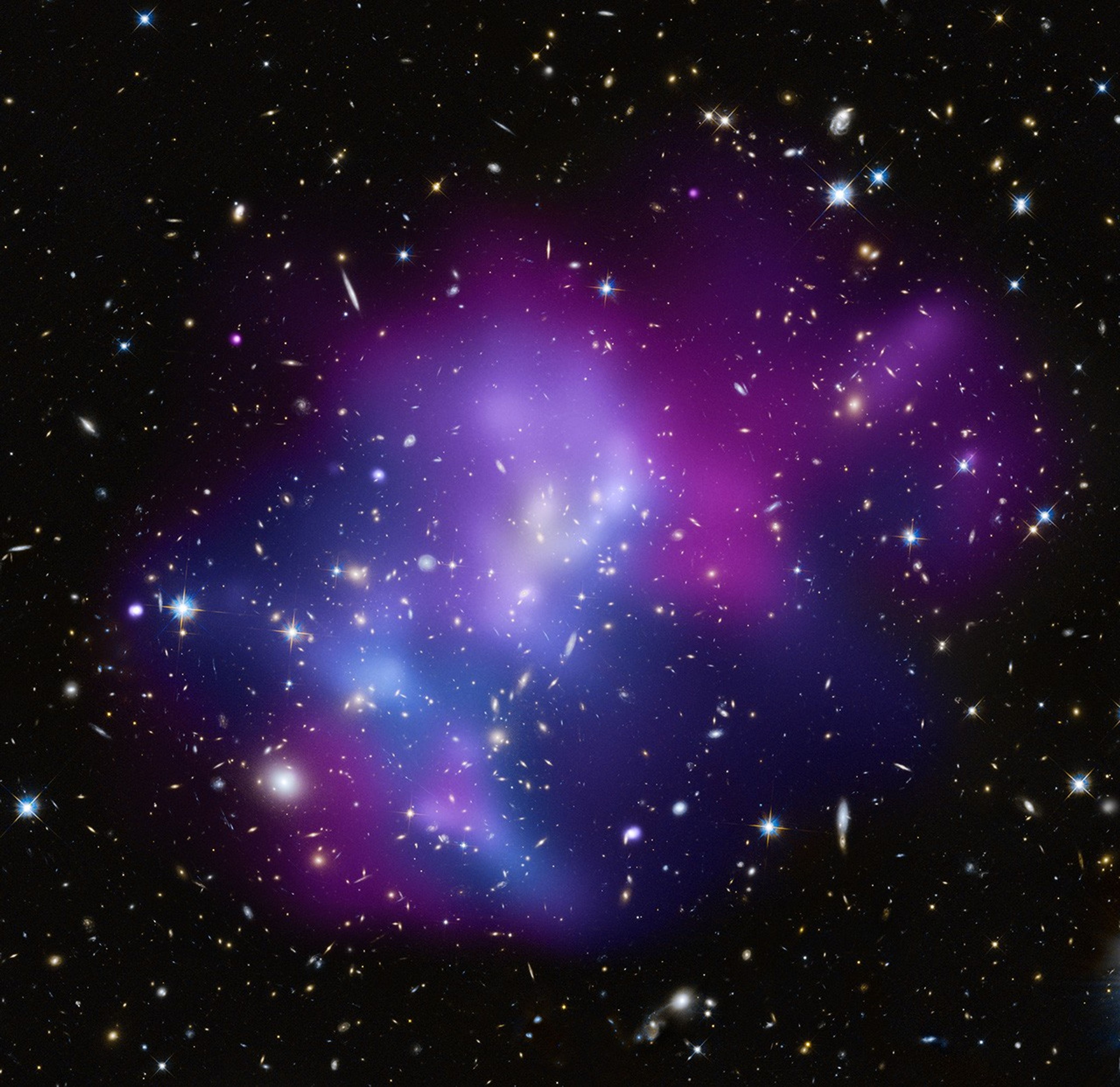 A black background is dotted with galaxies and a few foreground stars. Blobs of purple, blue, and reddish-purple denote temperature of matter.