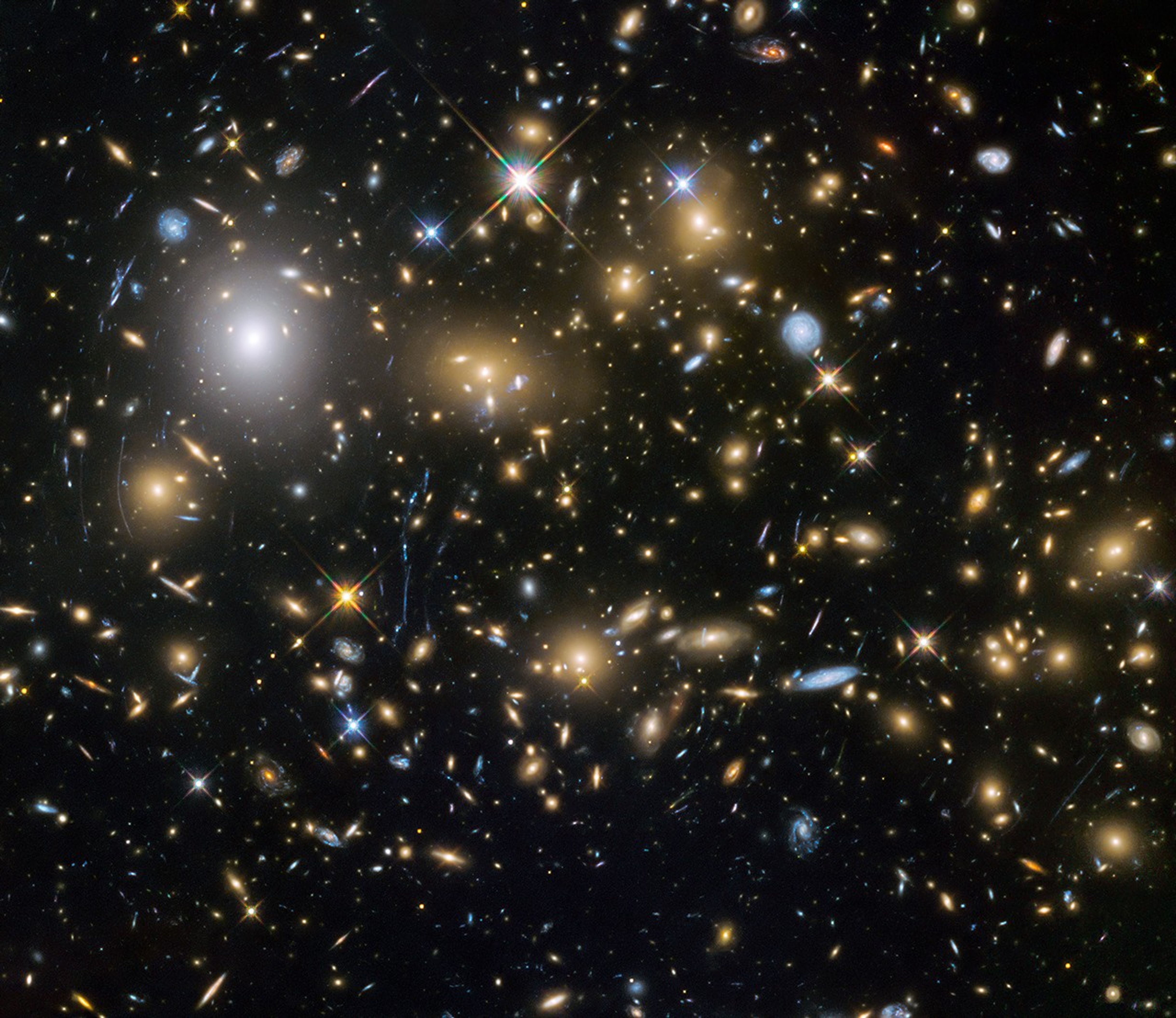 Large sample galaxies of different sizes and shapes, experiencing a lens-like distortion.