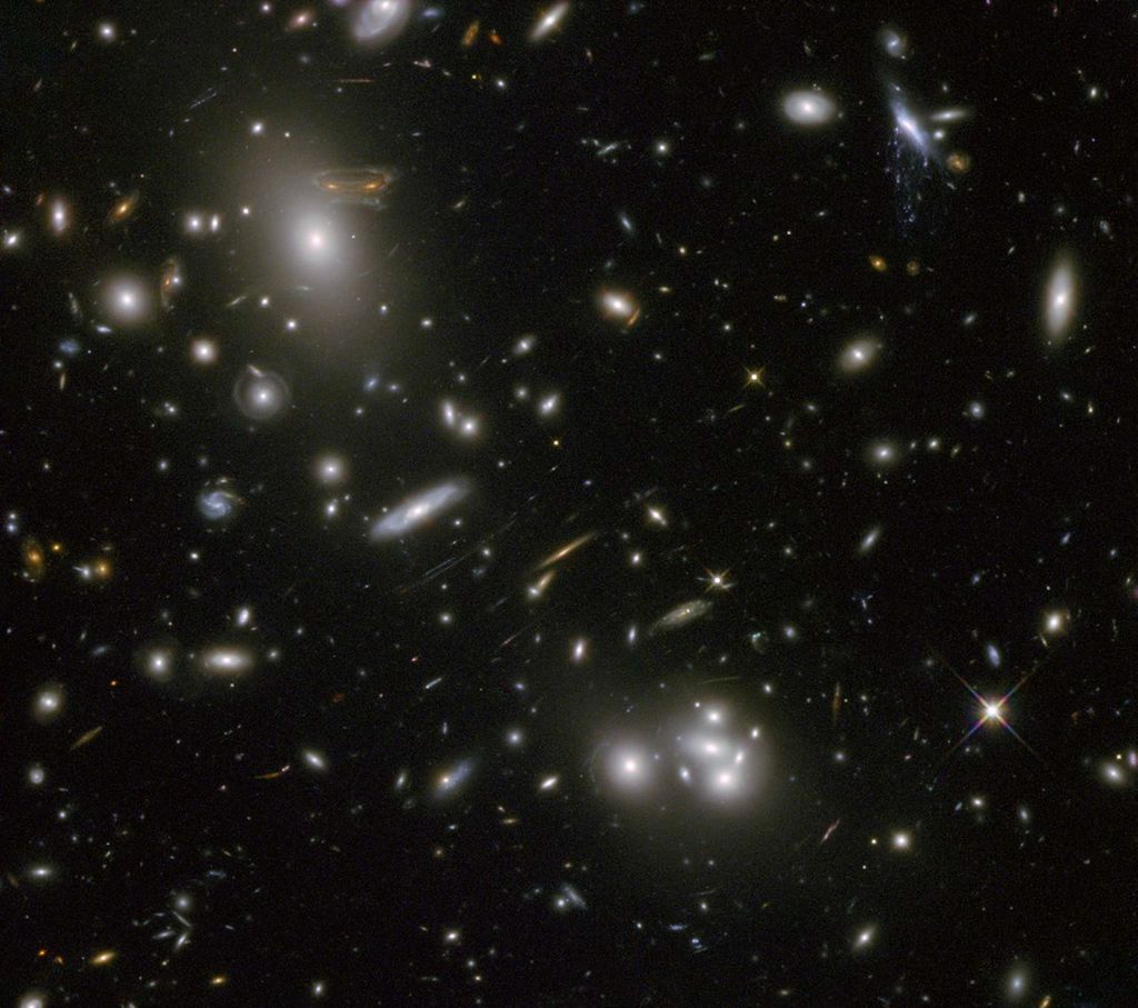 Large sample galaxies of different sizes and shapes, experiencing a lens-like distortion.