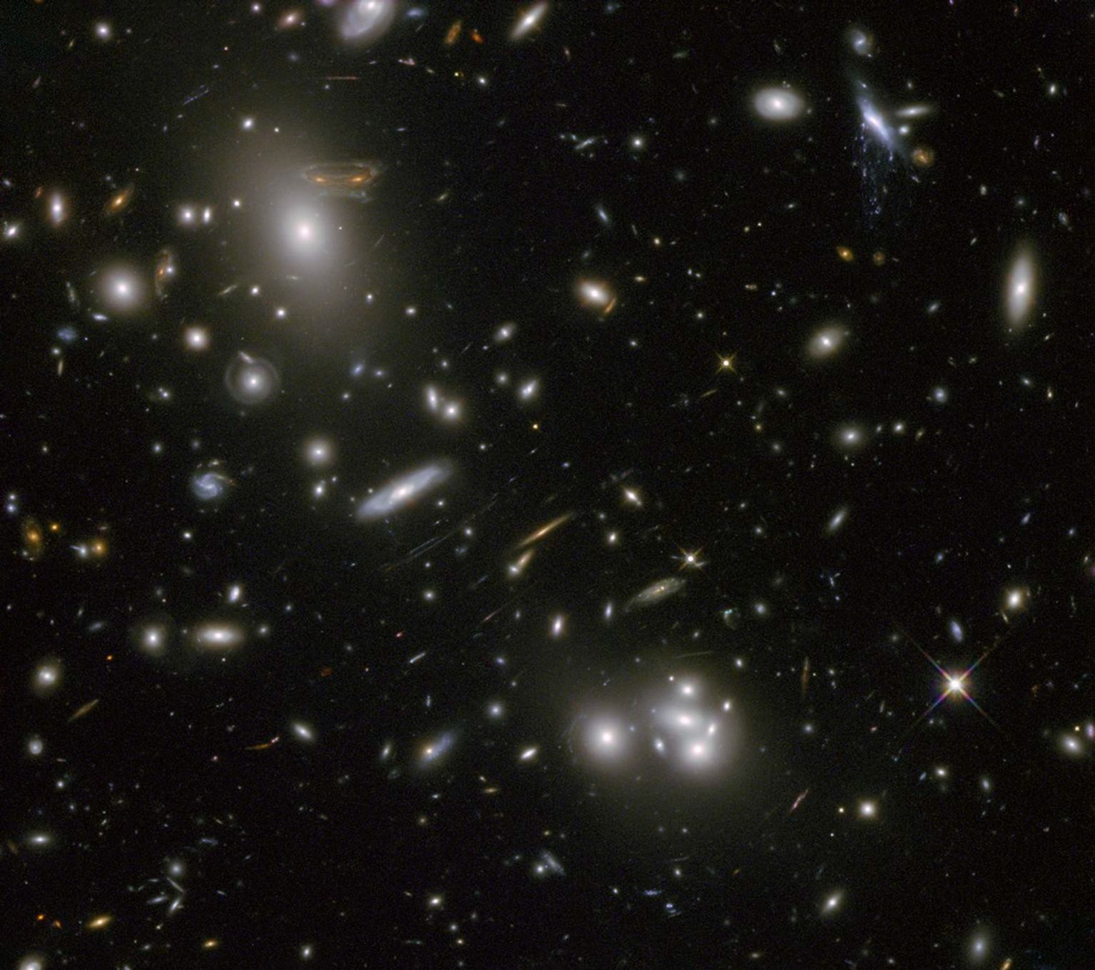 Large sample galaxies of different sizes and shapes, experiencing a lens-like distortion.