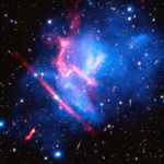 A black background is dotted with galaxies and a few foreground stars. Most of the center, from the lower-left to upper right, is filled with translucent blobs of various shades of blue, sometimes blended with purple, to denote temperature of matter. There are also a couple streaks/blobs of pinkish-red