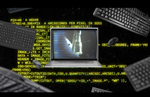 Hubble appears on the screen of a laptop surrounded by yellow, technical-looking digital text and keyboards