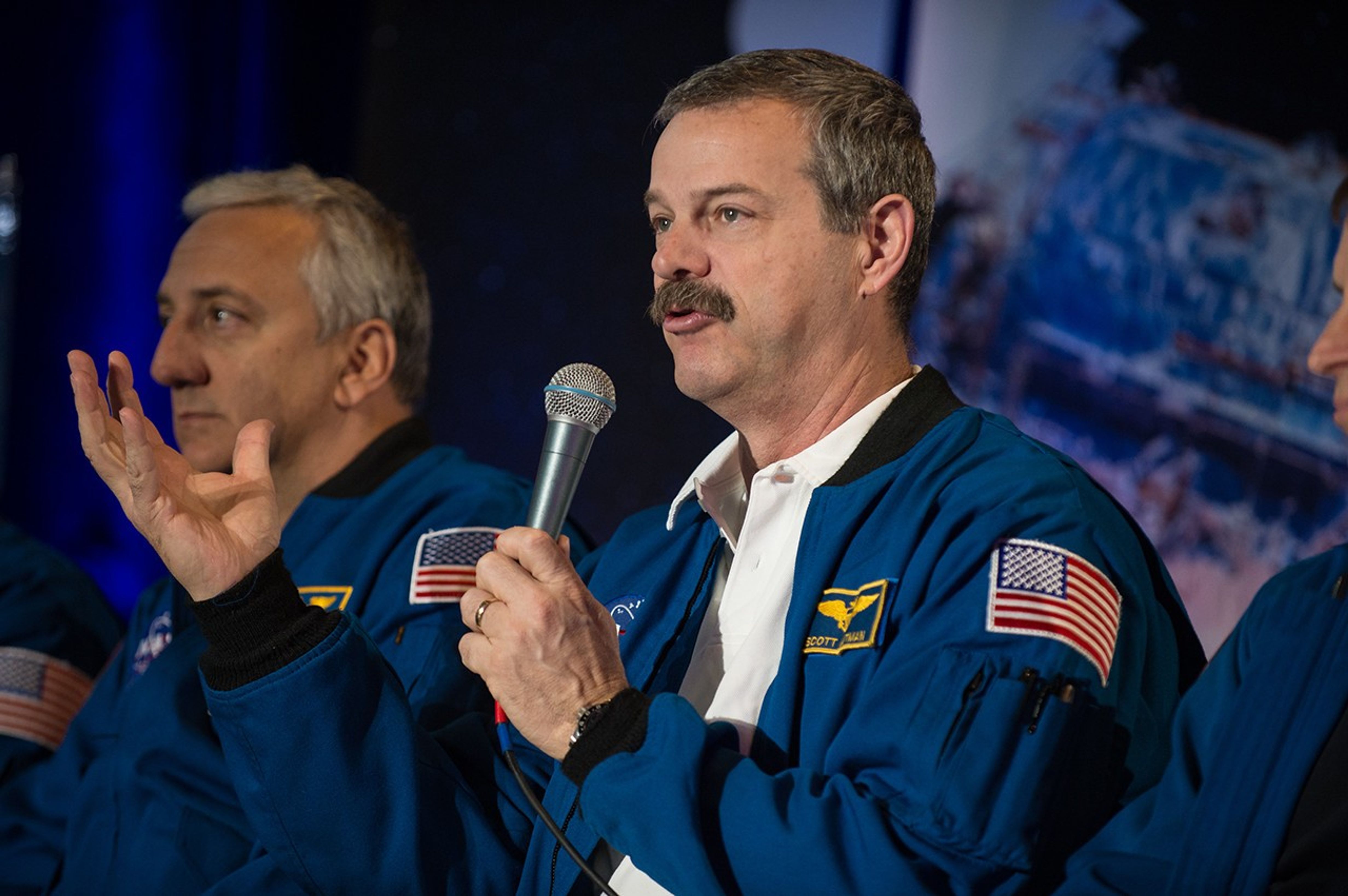 Astronaut Scott Altman, center, addresses the audience.